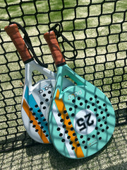 2 padel rackets in a padel court